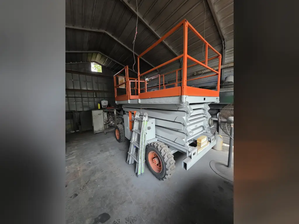 SKYJACK scissor lift for sale in Cairo, SKYJACK 8841s model 1999, located in Giza, the best site for selling trucks and heavy equipment in Egypt